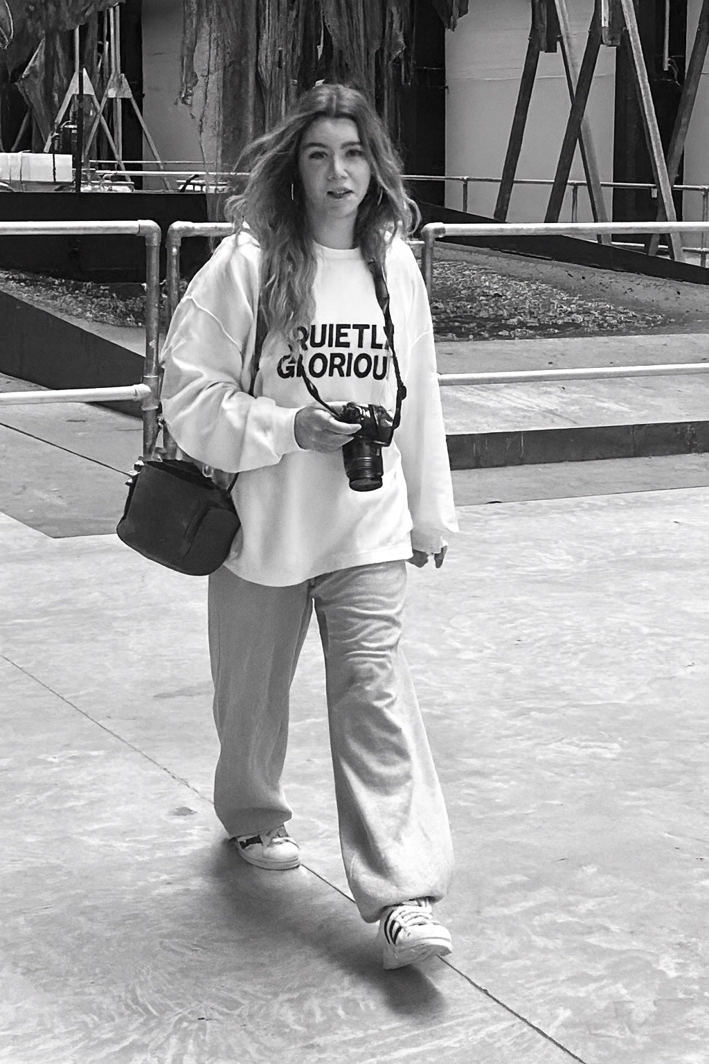 EJay wearing Quietly Glorious in a black and white editorial photograph